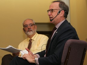 Tim Miller/The Intelligencer
Don Valley West MP, Rob Oliphant, speaks to a packed room at Bridge Street United Church on the topic of physician-assisted death while Rev. David Mundy looks on, on Friday in Belleville.