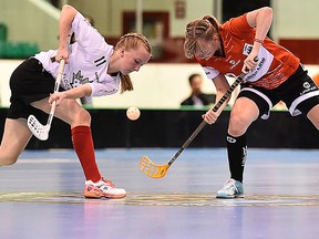 Canada's Emily Lange, of Trenton, faces-off with a German opponent during U19 women's floorball world championship action Friday night at Yardmen Arena. (Aaron Bell photo)