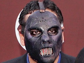 In this Feb. 13, 2005 file photo, Paul Gray from the group Slipknot arrives for the 47th Annual Grammy Awards in Los Angeles. The Iowa Supreme Court says deceased Slipknot bassist Paul Gray's daughter may sue for loss of a parent's companionship, even though she was born after her father died. The ruling Friday May 6, 2016, comes in the wrongful death lawsuit that Gray's widow filed after the heavy metal bassist died of a drug overdose in May 2010. (AP Photo/Mark J. Terrill, File)