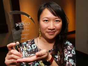 Toronto Sun reporter Jenny Yuen with her award. (MICHAEL PEAKE, Toronto Sun)