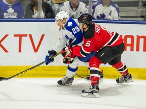 Toronto Marlies forward Connor Brown and Albany Devils defenceman Damon Severson battle during the first period of a playoff game at the Ricoh Coliseum in Toronto on May 4, 2016. (Ernest Doroszuk/Toronto Sun/Postmedia Network)