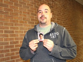 Derek Trepanier, of Sarnia, shows a school photo of himself during his time at the former Father Gerald LaBelle Catholic School in Corunna. The 34-year-old personal support worker has filed a $3-million lawsuit against the Roman Catholic Diocese of London, alleging he was sexually abused by Father Gary Roy. Barbara Simpson/Sarnia Observer/Postmedia Network
