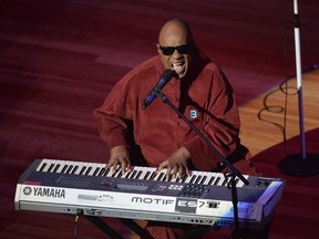 In this Sunday, Feb. 28, 2016 photo, Stevie Wonder performs at the #JusticeForFlint event in Flint, Mich. (Conor Ralph/The Flint Journal-MLive.com via AP)