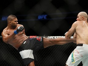 Alistair Overeem lands a kick against Junior Dos Santos during UFC Fight Night at Amway Center. (Reinhold Matay/USA TODAY Sports)