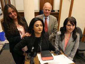 Liberal Party Leader Rana Bokhari (second left) gets choked up after accepting a gift from MLA Judy Klassen (left) as MLAs Jon Gerrard and Cindy Lamoureux look on following their swearing in ceremony at the Manitoba Legislature on Sat., May 7, 2016. Kevin King/Winnipeg Sun/Postmedia Network