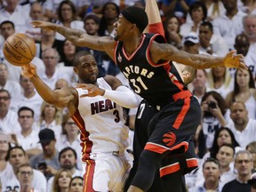 Toronto Raptors forward Terrence Ross (31) blocks a shot by Miami Heat guard Dwyane Wade (3) during Game 3 of their NBA second-round playoff series Saturday, May 7, 2016, in Miami. (AP Photo/Alan Diaz)