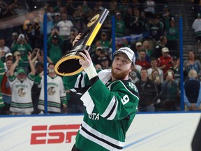 North Dakota Fighting Hawks forward Drake Caggiula skates around with the trophy after beating the Quinnipiac Bobcats 5-1 in the championship game of the 2016 Frozen Four tournament at Amalie Arena(Kim Klement/USA TODAY Sports)