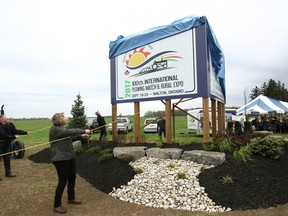 It took a small group to unveil the new 100th International Plowing Match & Expo sign in Walton Ont.(Shaun Gregory/Huron Expositor)