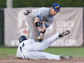 Maple Leafs' shortstop Ryan White attempts to lay the tag on London Majors' Humberto Ruiz during an Intercounty Baseball League game last season. White was born without full vision in his left eye, but it hasn't kept him from the game he loves. (DEREK RUTTAN/POSTMEDIA NETWORK)