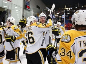 Members of the Brandon Wheat Kings celebrate Jayce Hawryluk's OT winner in the 3-2 victory over the Seattle Thunderbirds in Game 2 of the WHL final, Saturday, May 7, 2016, at Westman Place in Brandon.
Photo by Tim Smith/Brandon Wheat Kings