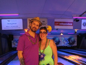 Chris and Susan Matt, from London, went all out with their Mardi Gras-inspired costumes during the Bowl for Kids Sake fundraiser on Saturday, May 7, 2016. Supporting Big Brothers Big Sisters is especially important for Susan, who was mentored by a Big Sister when she was growing up in Ingersoll. (MEGAN STACEY/Sentinel-Review)