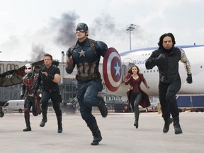 In this image released by Disney, Anthony Mackie, from left,  Paul Rudd, Jeremy Renner, Chris Evans, Elizabeth Olsen and Sebastian Stan appear in a scene from "Captain America: Civil War." (Disney-Marvel)