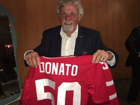 Toronto Sun cartoonist Andy Donato holds the personalized jersey he received for his 50 years in the business during a gala Saturday, May 7, 2016 at the Bata Shoe Museum. (Jenny Yuen/Toronto Sun)