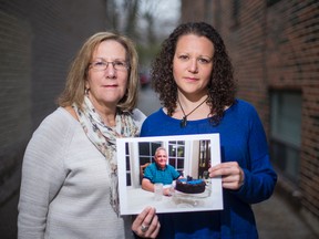 Carly Brenner, right, with mom Shari Brenner, a cancer survivor, holds a photo of her late father,  Laurence Brenner, who died of cancer. (Ernest Doroszuk/Toronto Sun)