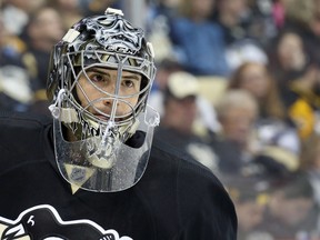 Pittsburgh Penguins goalie Marc-Andre Fleury looks on against the New Jersey Devils during the third period at the CONSOL Energy Center. The Devils won 3-0. (Charles LeClaire/USA TODAY Sports)