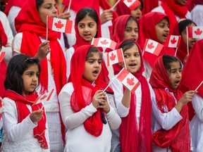 Children sing the Canadian national anthem as the Ahmadiyya Muslim Jama`at community marked 50 years of being in Canada. (ERNEST DOROSZUK, Toronto Sun)