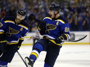 St. Louis Blues' Alexander Steen, right, and teammate Alex Pietrangelo celebrate after the Blues' 4-3 victory over the Chicago Blackhawks in Game 7 of an NHL hockey first-round Stanley Cup playoff series Monday, April 25, 2016, in St. Louis. The Blues the series 4-3. (AP Photo/Jeff Roberson)