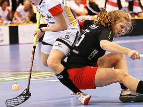 Germany's Anna-Lena Best collides with Canada captain Hannah Wilson, of Belleville, during the IFF women's U19 world championship B Group final Sunday at Yardmen Arena. (Tim Miller/The Intelligencer)