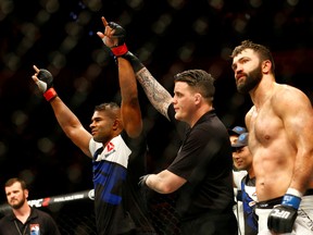 Alistair Overeem celebrates his victory over Andrei Arlovski. (REUTERS/Michael Kooren)