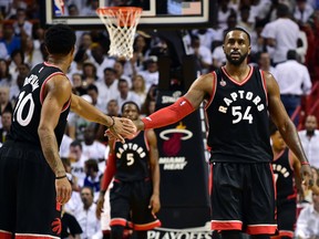 Toronto Raptors guard DeMar DeRozan greets Raptors forward Patrick Patterson during the third quarter in game three of the second round of the NBA Playoffs agent the Miami Heat at American Airlines Arena. (Steve Mitchell/USA TODAY Sports)