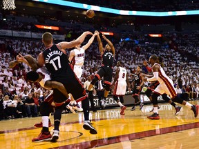 Toronto Raptors guard Kyle Lowry shoots over Miami Heat guard Goran Dragic during the first quarter in game three of the second round of the NBA Playoffs at American Airlines Arena. (Steve Mitchell/USA TODAY Sports)