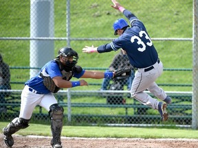 Guelph Royals catcher Saul Tahuite tags out a leaping Jon Waltenbury of the Maple Leafs at home plate to end the fourth inning during Sunday's IBL season opener at Dominico Field at Christie Pits. (DAN HAMILTON/VANTAGE POINT STUDIOS)