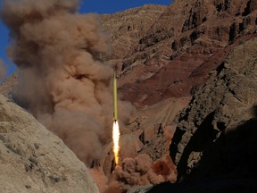 In this Wednesday, March 9, 2016 file photo obtained from the Iranian Fars News Agency, a Qadr H long-range ballistic surface-to-surface missile is fired by Iran's powerful Revolutionary Guard, during a manoeuvre, in an undisclosed location in Iran. (AP Photo/Fars News Agency, Omid Vahabzadeh)