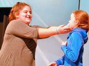 Holly Blackburn (left), who plays Ursula, and Gwenyth McKay, who plays Ariel, rehearse the Upper Thames Elementary School (UTES) Music Department's operetta, The Little Mermaid, in the UTES gym May 4. GALEN SIMMONS MITCHELL ADVOCATE