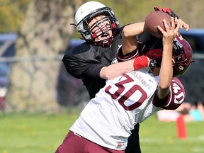 Wallaceburg Tartans' Brody Genys (30) breaks up a pass intended for McGregor Panthers' Cameron Welch in the third quarter of their LKSSAA junior 12-man football game at John McGregor Secondary School in Chatham, Ont., on Friday, May 6.