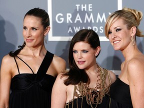 In this Feb. 11, 2007, file photo, the Dixie Chicks, Emily Robison, left, Natalie Maines, center, and Martie Maguire, who earned five Grammy nominations, arrive for the 49th Annual Grammy Awards in Los Angeles. The Dixie Chicks are ready to party in the USA with a summer 2016 tour. (AP)