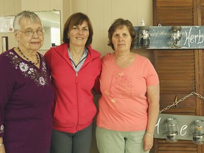 From the left, standing behind the herb hangers that were created by a small group of women from the Egmondville United Church is Jean Dragger, Linda Doig and Janet Penno.(Shaun Gregory/Huron Expositor)