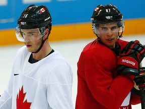 Canada's Jonathan Toews (left) and Sydney Crosby (right) look on during their practice at the Sochi Winter Olympics on Feb. 12, 2014. Canada will hold its World Cup training camp in Ottawa in September. (Mark Blinch/Reuters/Files)