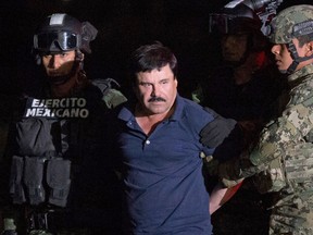 In this Jan. 8, 2016 file photo, Mexican drug lord Joaquin "El Chapo" Guzman is escorted by soldiers to a waiting helicopter at a federal hangar in Mexico City, after he was recaptured from breaking out of a maximum security prison in Mexico. A Mexican judge said on Monday, May 9, 2016 that Guzman's extradition to the U.S. can move ahead, but the country’s foreign ministry must still approve it and the defence can appeal. (AP Photo/Rebecca Blackwell, File)