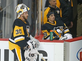 Penguins goalies Matt Murray (30) and Marc-Andre Fleury (29) look at the scoreboard during Game 4 against the Capitals in Pittsburgh, on May 4, 2016. With Fleury ready to play, the Penguins are staying with Murray in net for Game 6 on May 10. (Gene J. Puskar/AP Photo)