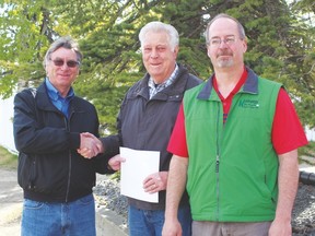 Pictured (from l. to r.) are Dale Symon, incoming chair of the co-op; Wes Davidson, outgoing chair and Kevin Lang, co-op manager.