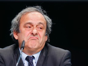 In This May 28, 2015 file photo UEFA president Michel Platini grimaces during a press conference following a meeting of the UEFA board ahead of the FIFA congress in a hotel in Zurich, Switzerland.  (AP Photo/Michael Probst, file)