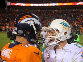 Quarterback Peyton Manning of the Denver Broncos and quarterback Ryan Tannehill of the Miami Dolphins.  (Justin Edmonds/Getty Images/AFP)