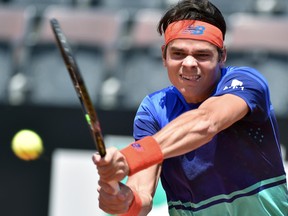 Milos Raonic of Canada returns the ball to Marco Cecchinato of Italy during their match  at the Italian Open tennis tournament, in Rome, Monday, May 9, 2016. (Ettore Ferrari/ANSA via AP Photo)