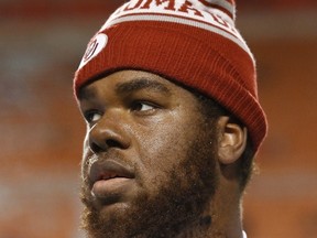 Oklahoma offensive tackle Josiah St. John is pictured before an NCAA college football game between Oklahoma and Okalhoma State in Stillwater, Okla. on Nov. 30, 2015. (THE CANADIAN PRESS/AP/Sue Ogrocki)