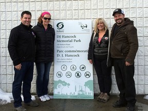 Photo supplied
Jay Quesnel, left, Melissa Sheridan and Kim and Dean Hancock, parents of DJ Hancock, pose beside a sign for the DJ Hancock Memorial Park, set to open at the former Lockerby Tot Lot this summer.