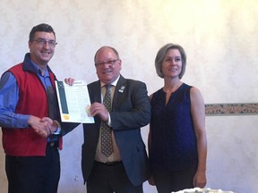 Paul-Andre Gauthier, Mayor Brian Bigger and Lise Thomas hold the declaration proclaiming May 9-15 National Nursing Week. (Mary Katherine Keown/Sudbury Star)