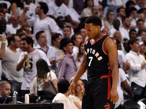 Toronto Raptors guard Kyle Lowry walks back to the bench during the second quarter in Game 4 of the second round of the NBA Playoffs against the Miami Heat at American Airlines Arena in Miami on May 9, 2016. (Steve Mitchell/USA TODAY Sports)