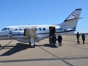 Potential passengers board an Integra Air plane for a tour during the airline's kickoff barbecue held on Wednesday April 15, 2015 in Bonnyville, Alta. Celina Ip/Postmedia Network