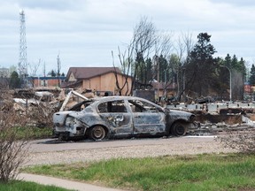 Damage from the wildfires is seen in the Beacon Hill neighbourhood in Fort McMurray, Alta., on Monday, May 9, 2016. THE CANADIAN PRESS/Ryan Remiorz