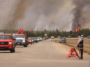 People flee the Fort McMurray wildfire south on Hwy. 63.