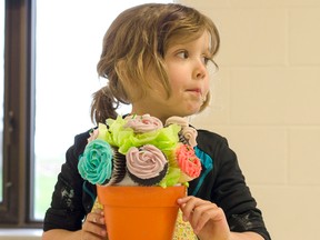 The Bruce Botanical Food Gardens Mother's Day Cupcake event saw a handful of parents and children out May 7, 2016 to make and decorate some colourful baked goods to celebrate their moms, in time for the special day. Pictured: Ella Goncalves, 6, shows of her 'bouquet'. (Darryl Coote/Reporter)