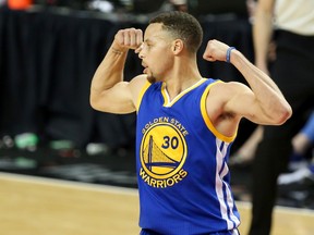 Warriors guard Stephen Curry flexes his muscles after making a basket in overtime against the Trail Blazers in Game 4 of the second round NBA playoff series in Portland, Ore., on Monday, May 9, 2016. Curry won the NBA's Most Valuable Player award Tuesday for the second year in a row. (Jaime Valdez/USA TODAY Sports)
