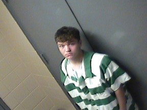 In this jail photo provided by Conway, Ark., Police Department, suspect Justin Staton stands by a door in Little Rock, Friday, Aug. 7, 2015. Staton and another teen were each charged as adults with two counts of capital murder Friday in the July 22 deaths of Robert and Patricia Cogdell at their home in Conway. (Conway Arkansas Police Department via AP)
