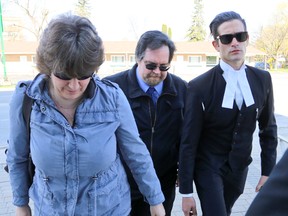 Fred King, center, follows an unidentified woman, left, and a member of his legal team into the courthouse on Tuesday, May 10, 2016 in Owen Sound, Ont. James Masters/The Owen Sound Sun Times/Postmedia Network