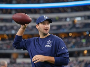 Injured Dallas Cowboys quarterback Tony Romo tosses a football prior to the team's NFL football game against the Seattle Seahawks in Arlington, Texas. (AP Photo/Brandon Wade, File)